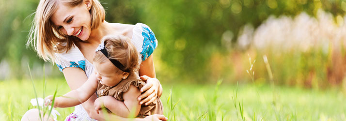 Chiropractic-Burbank-CA-Mother-is-Outside-on-the-Grass-with-her-Baby.jpg low back pain relief with chiropractic care